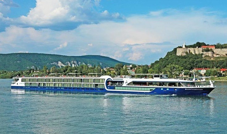 Avalon river cruise ship on the Rhine with hillside castle